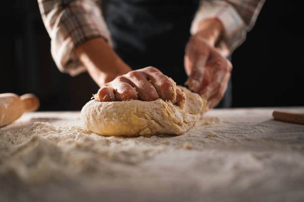 Baking concept - preparing pastry, kneading dough